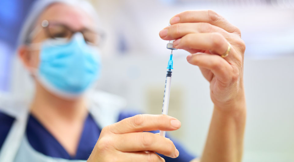 Nurse measuring injection dose