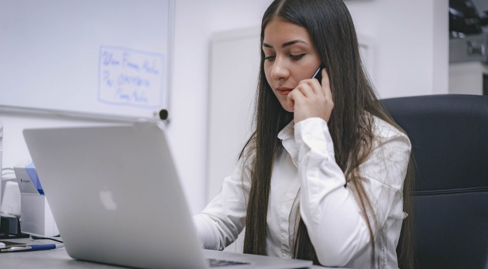 Image of woman calling to cancel her appointment. Photo by René Ranisch on Unsplash.