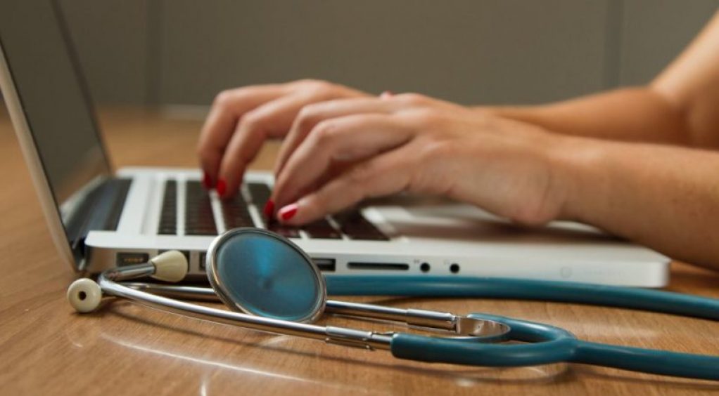 Photo of a doctor and her laptop by National Cancer Institute on Unsplash